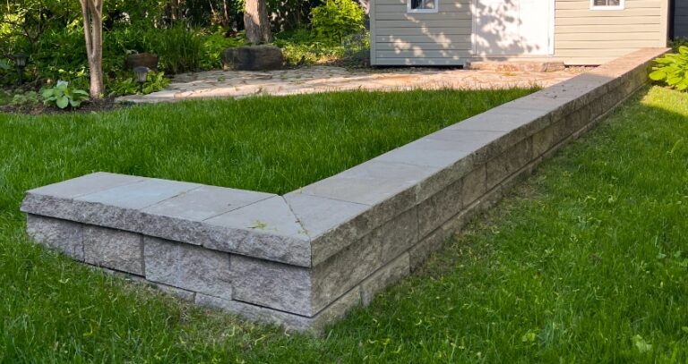 A small stone retaining wall in the West Island by Valleycat Landscaping