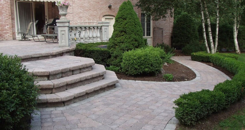 A beautiful winding path and stairs by paving contractors in the West Island Valleycat Landscaping